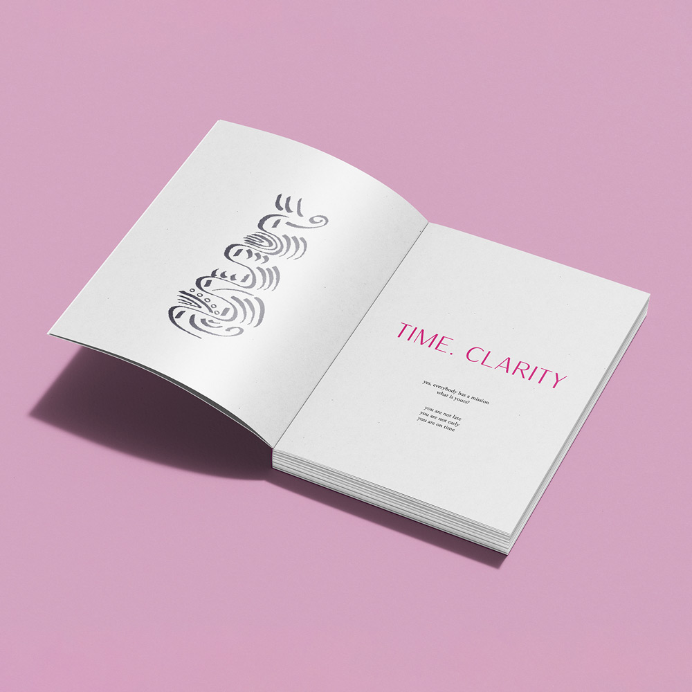 Mockup of an open poetry book showcasing layout design on a light pink background